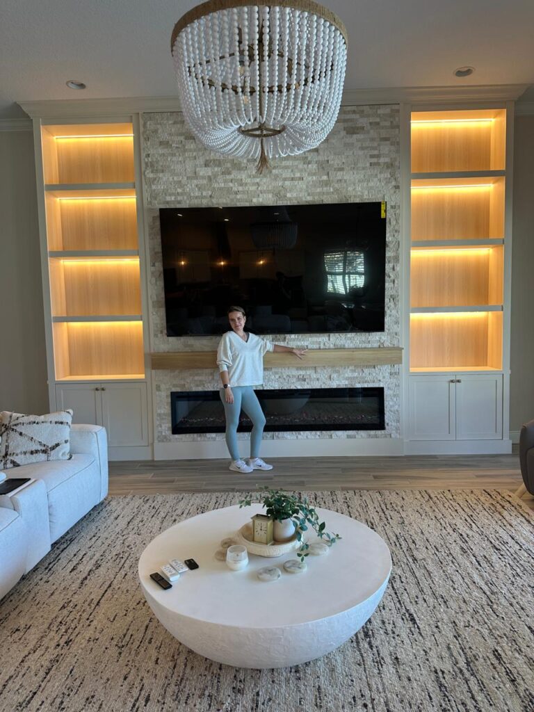 luxury TV wall built-ins with electric fireplace and LED shelves in Melbourne Florida
