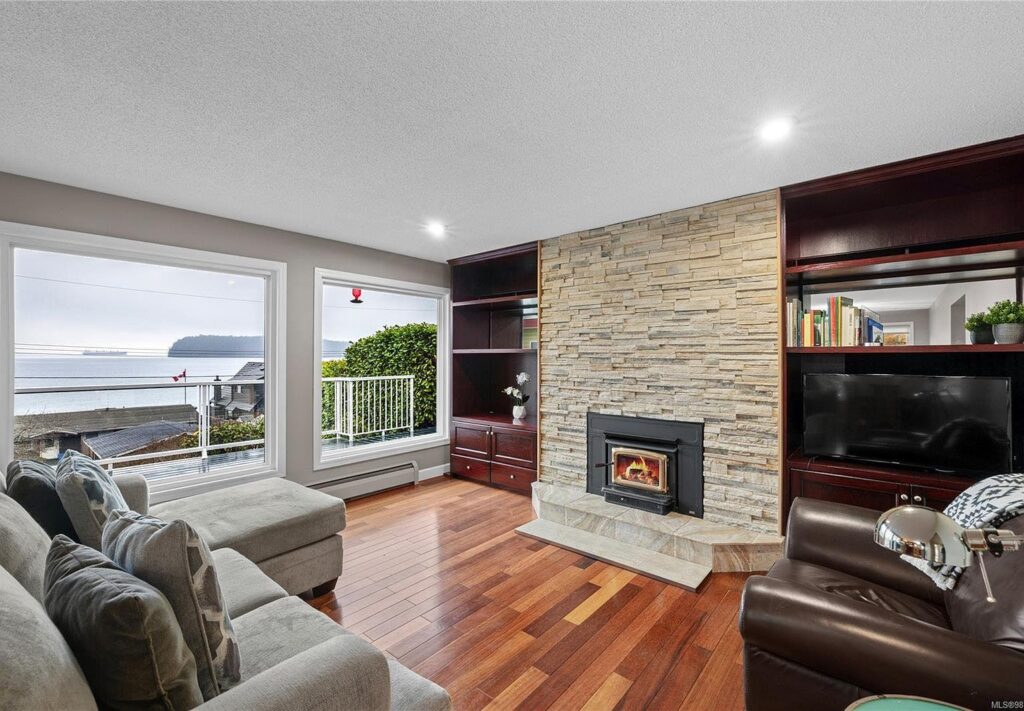 Stone fireplace wall installation in Melbourne FL with built in cabinets shelving and custom fireplace near me