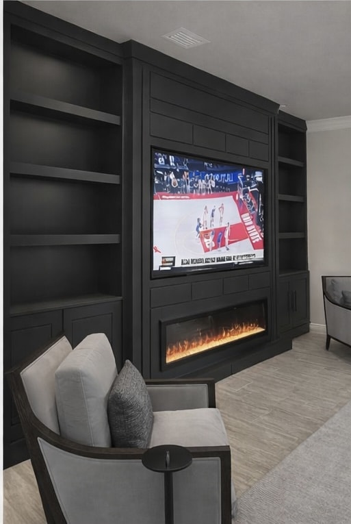 Modern black fireplace wall with built-in shelving and electric fireplace