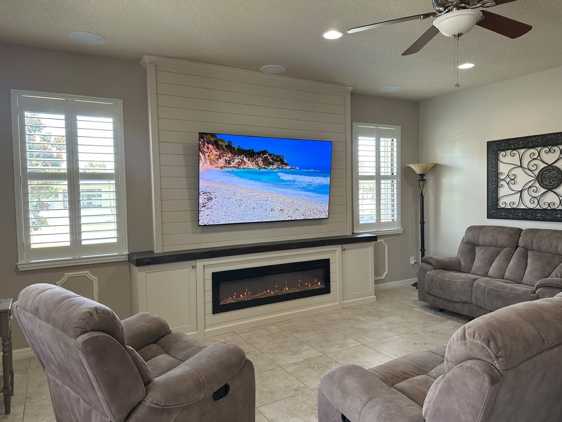 Clean white shiplap media wall with fireplace and cabinetry — fireplace walls florida