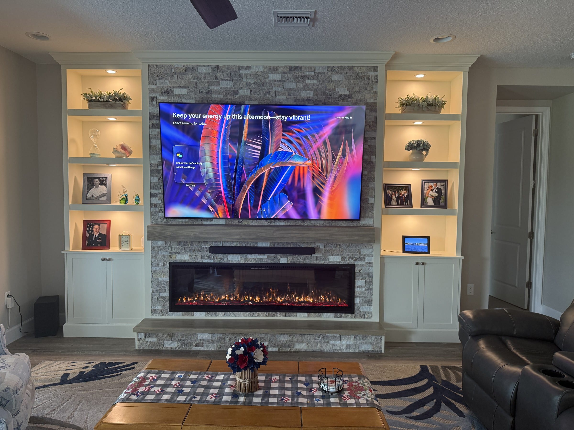 Stone fireplace wall with built-in shelving and cabinetry | fireplace wall cost florida Stone fireplace wall with built-in shelving and cabinetry — fireplace wall cost florida
