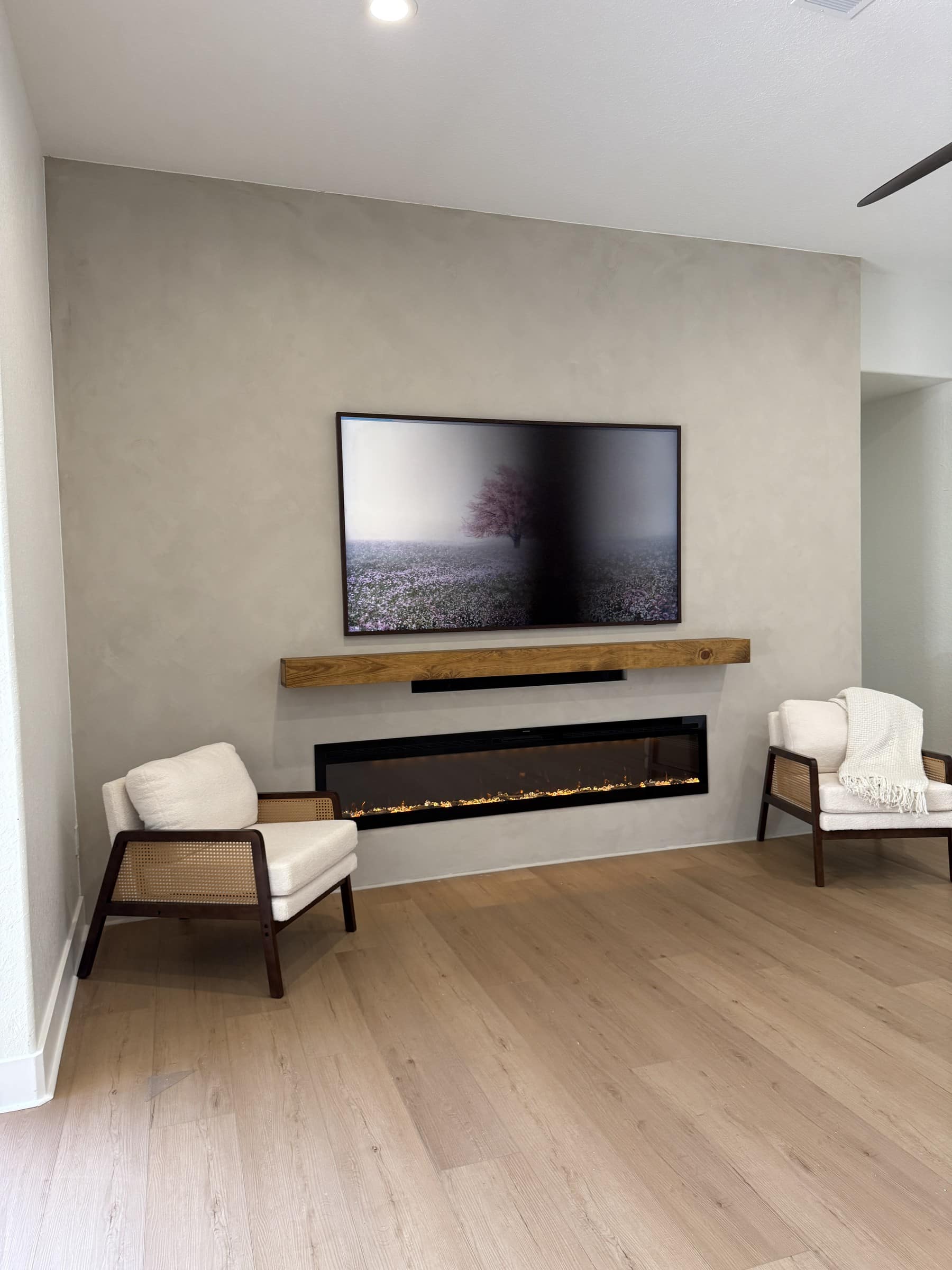 Custom green TV media wall with illuminated built-ins — custom TV walls Florida