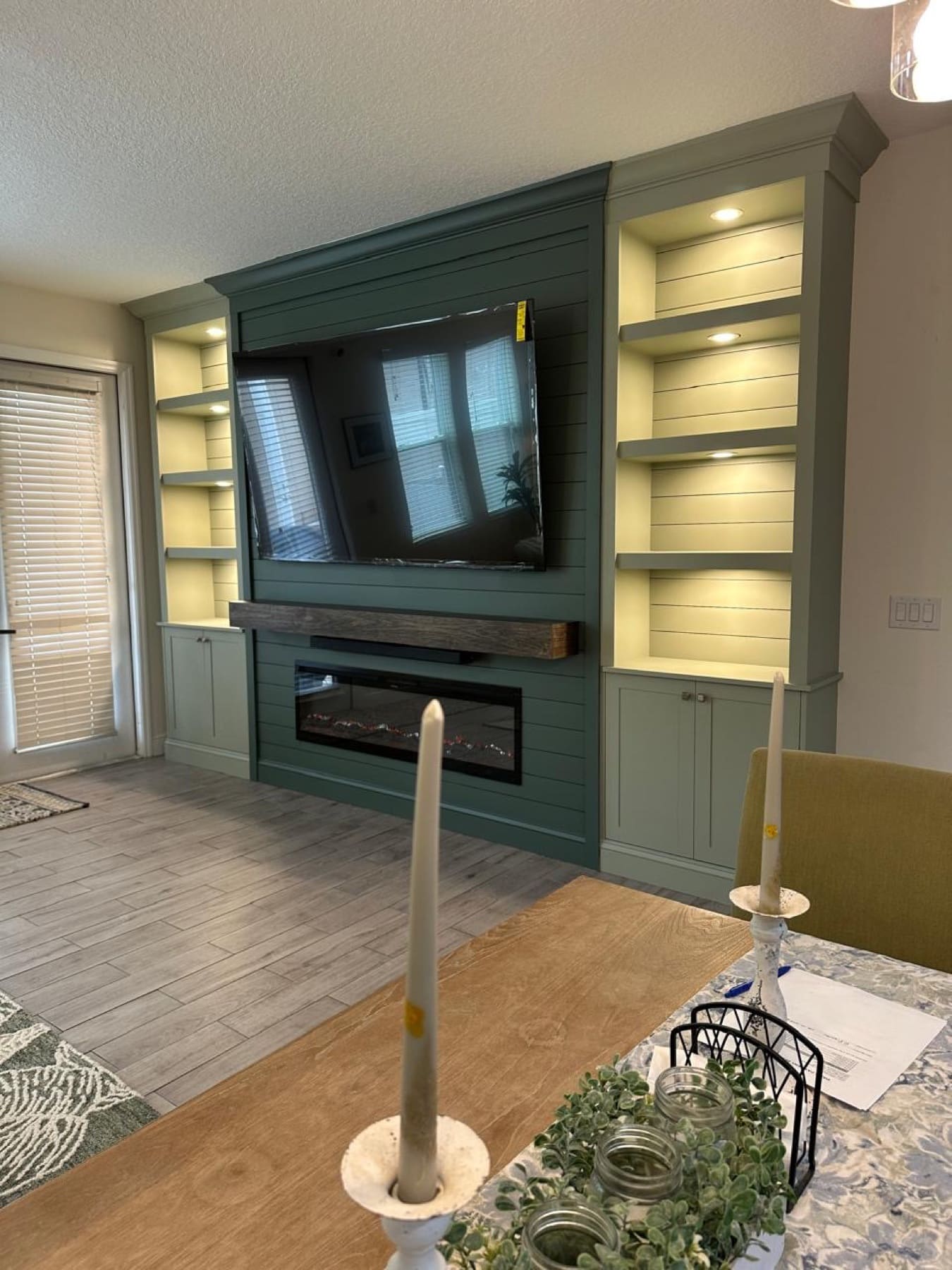 Windermere green media wall with illuminated built-ins — fireplace walls florida